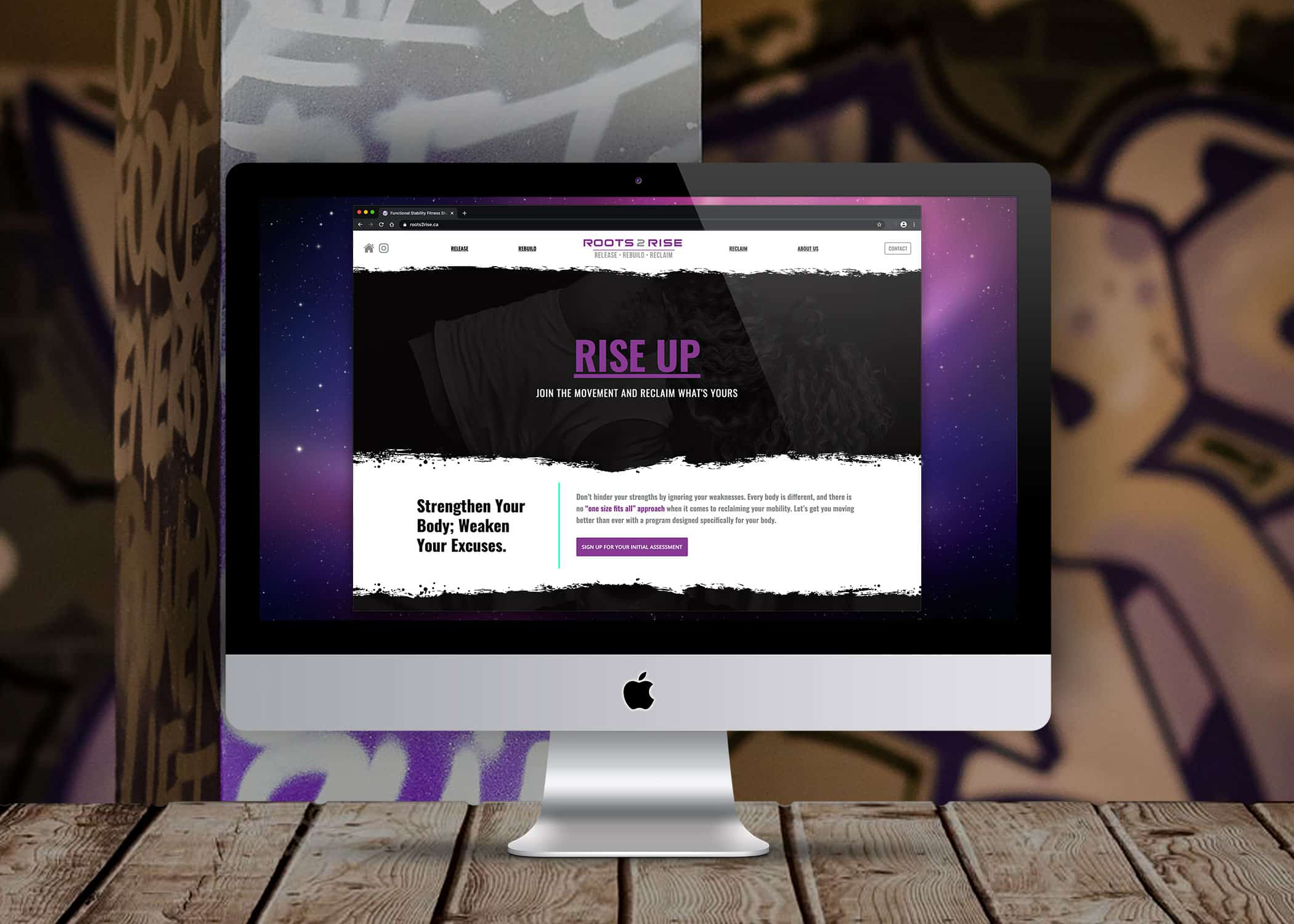 Roots 2 Rise website shown on a desktop computer